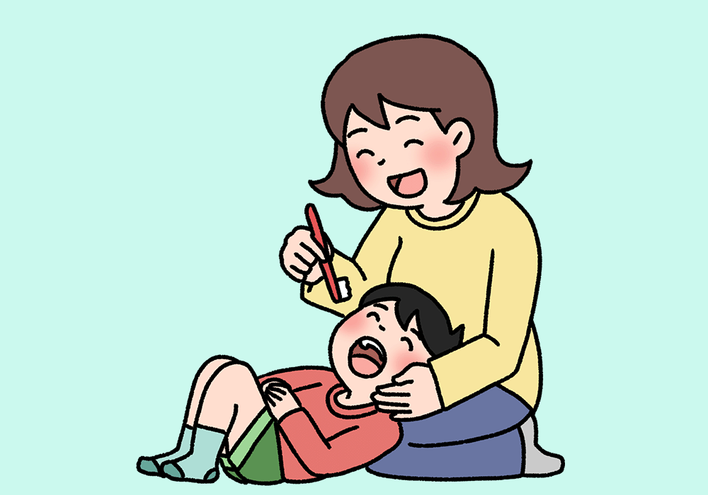 仕上げ磨きをする女性